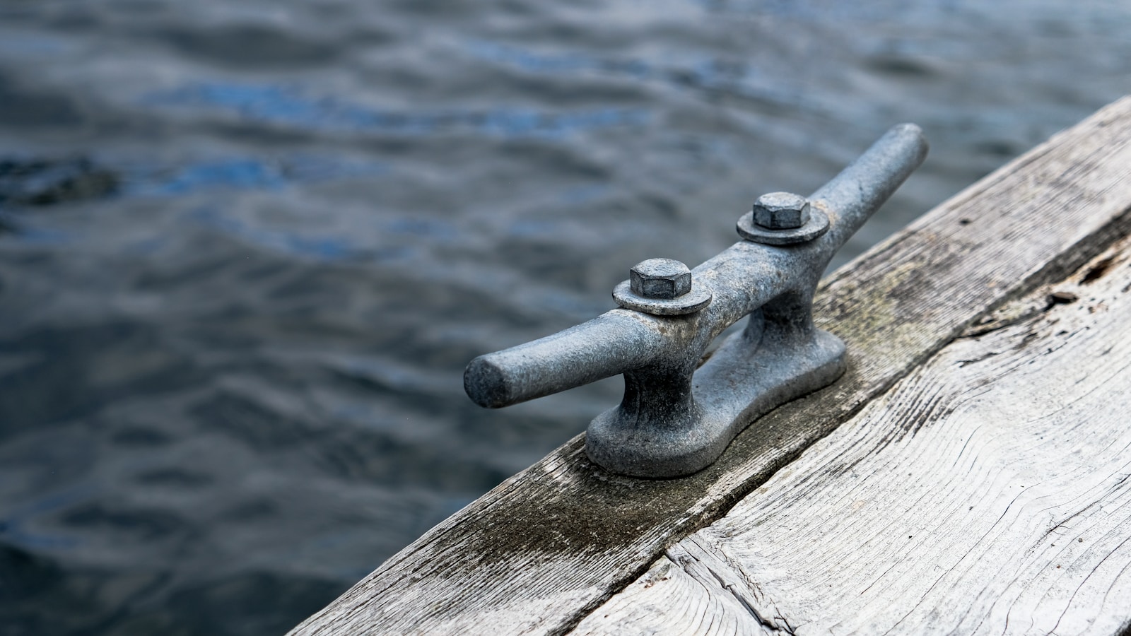 grey metal pipe on water